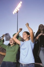 People in crowd cheering